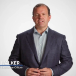 American businessman speaking about company sale and employee bonus program