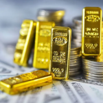 Gold bars and stacked gold coins representing rising gold prices